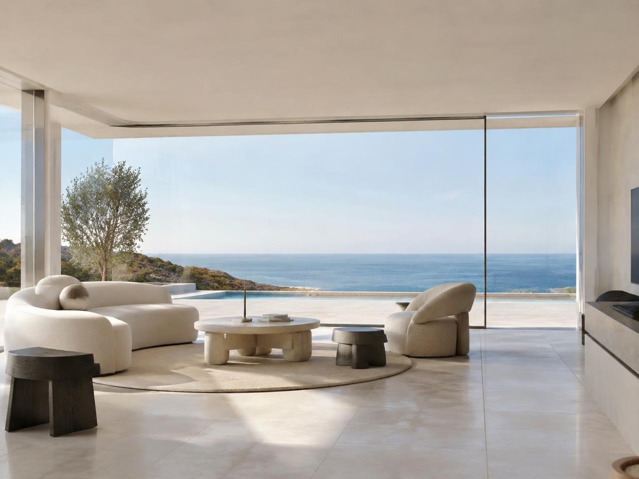 Glazed living room opening onto the sea terrace
